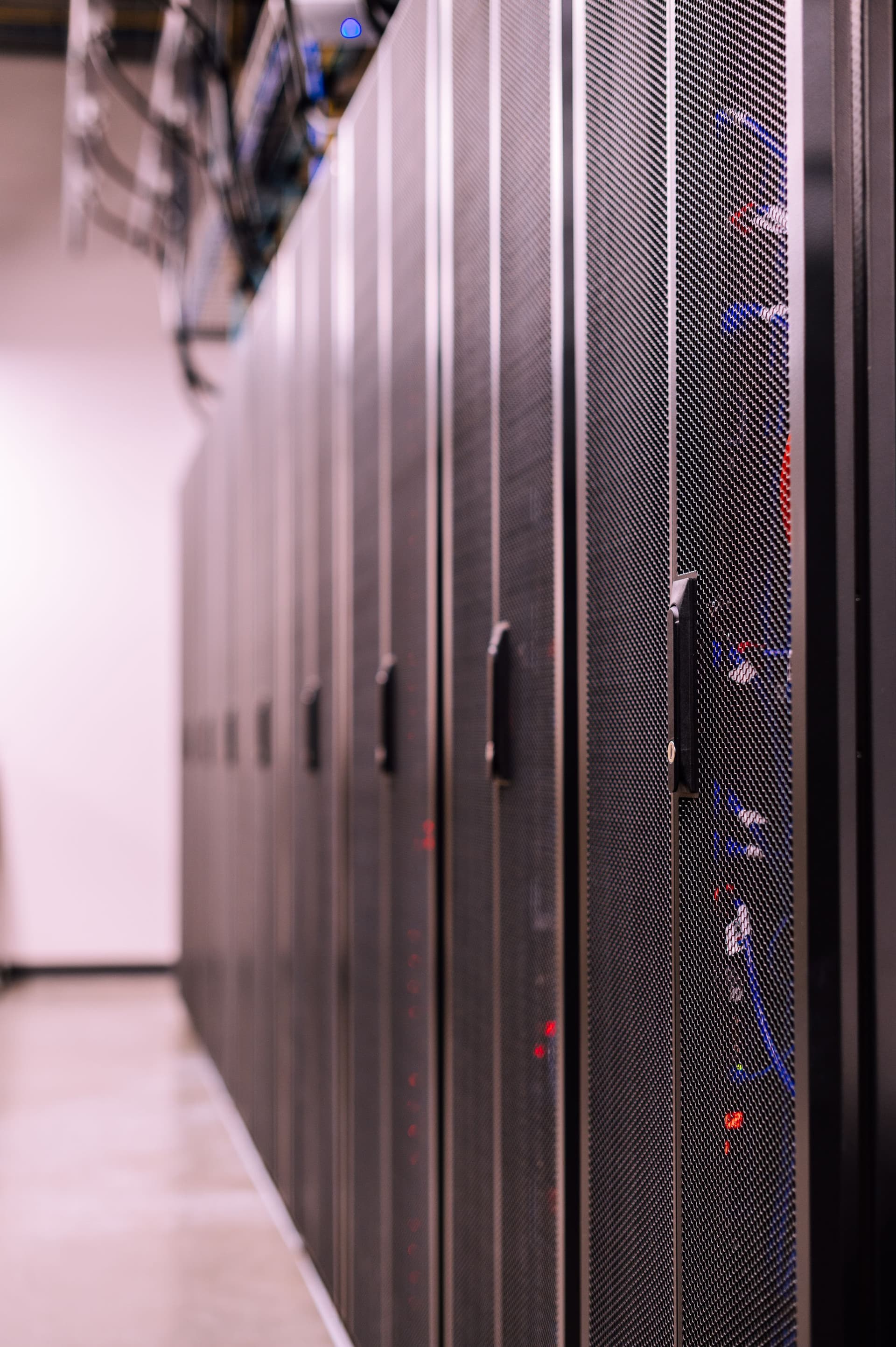 A row of commercial server and network equipment cabinets