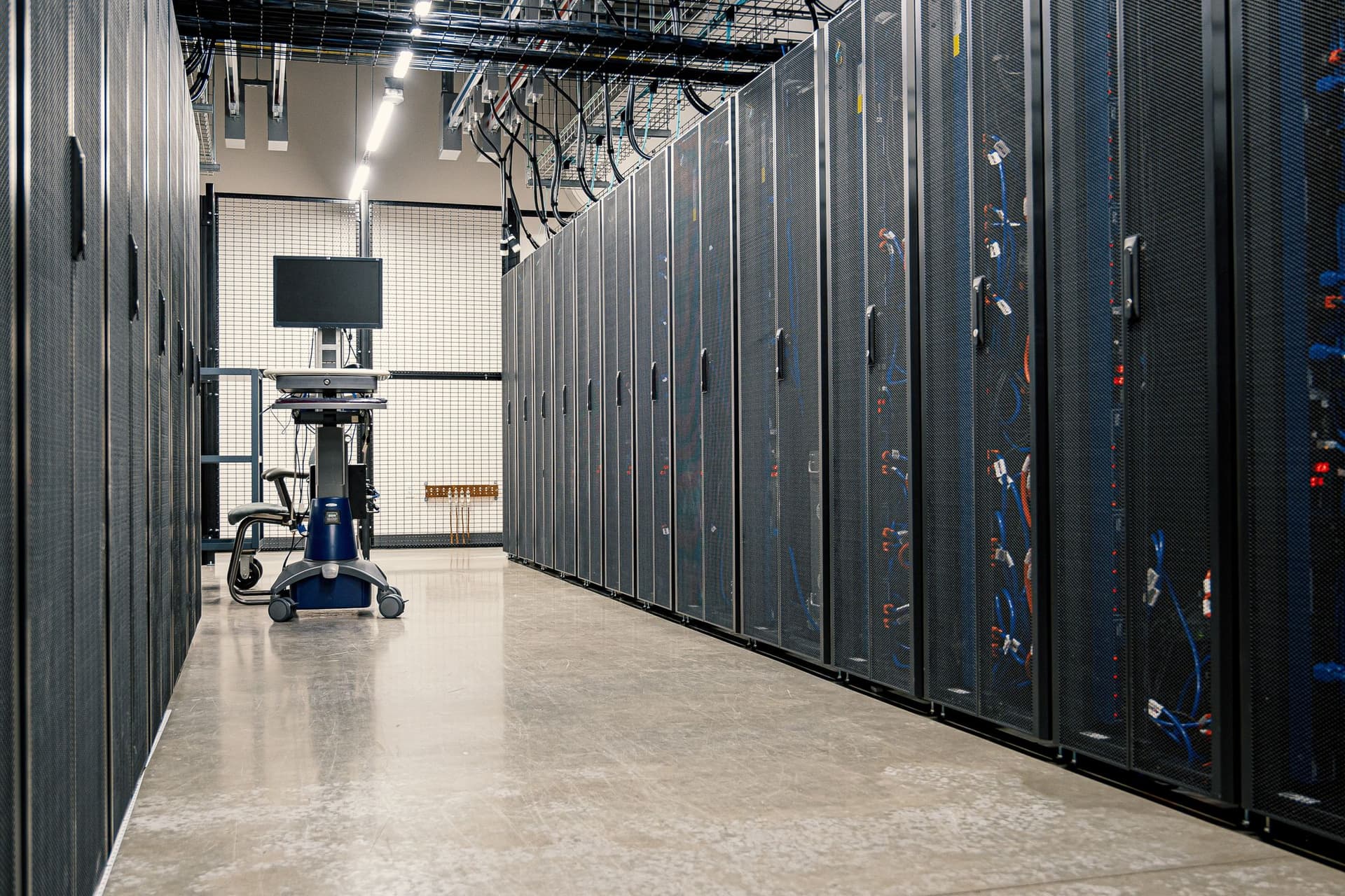 Rows of secured equipment racks in a modern commercial data center